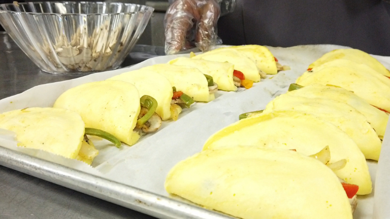 Fresh omelets on a service tray pan